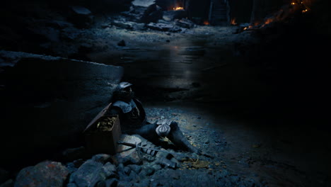 Silent resting place of a fallen knight discovered in a shadowy cave