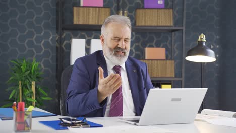 businessman sad seeing his failure on laptop.