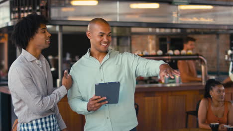 Male-Staff-Team-Working-In-Restaurant-Or-Coffee-Shop