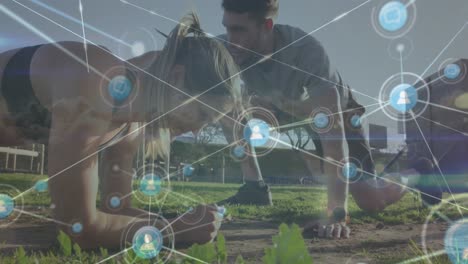 animación de iconos conectados con líneas sobre hombre caucásico entrenando a una mujer para hacer ejercicio en el parque.