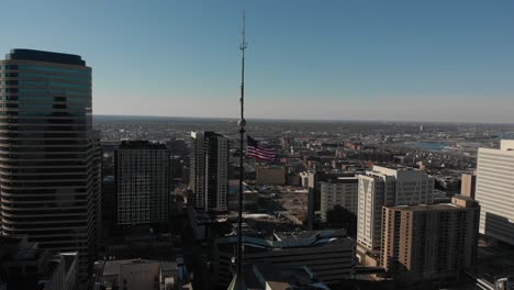 american flag, us flag above a city