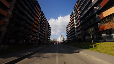 slowmotion tilting upward shot of apartment blocks for sale on each side