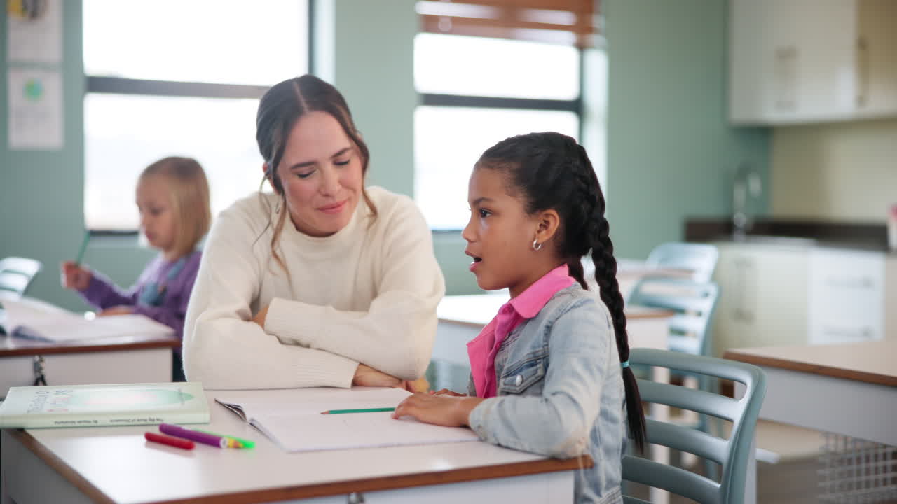 Teacher helping student in classroom