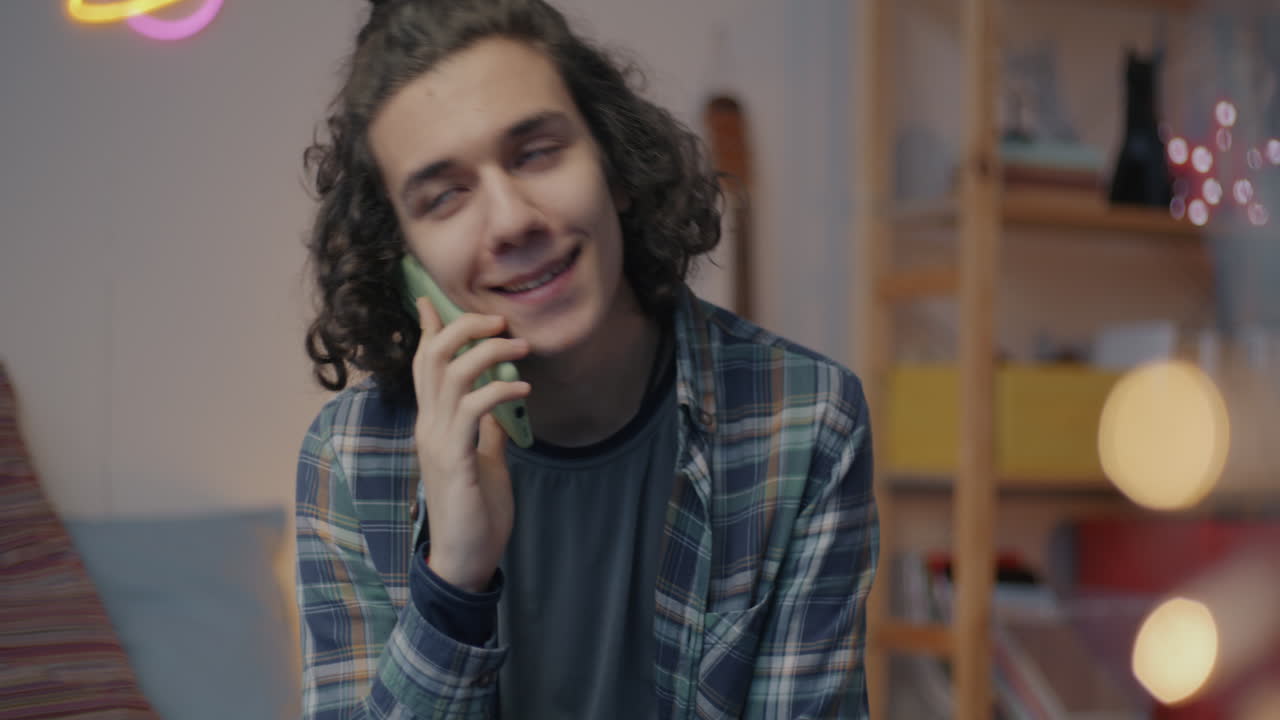 Teenager Talking on Phone at Home