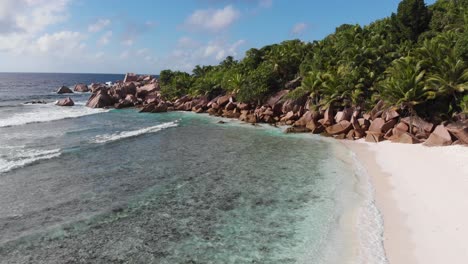 aerial view of the white beaches and turquoise waters at anse coco, petit anse and grand anse on la digue, an island of the seychelles