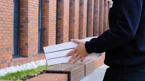 delivery guy giving the products to the client