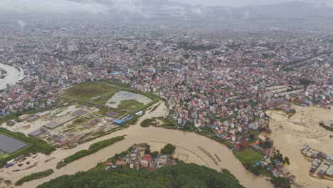 unmanaged urbanization at kathmandu valley nepal leads to destruction of lives and infrastructures due to sudden flood of bagmati river by cloud brust and climate crisis drone shot reveals disaster