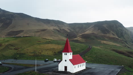 Aerial-drone-shot-of-local-Church-in-Vík-í-Mýrdal,-South-Iceland