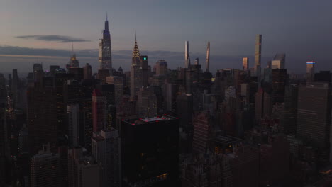 Slide-and-pan-footage-of-skyscrapers-in-midtown.-One-Vanderbilt,-Chrysler-and-Empire-State-Building.-Manhattan,-New-York-City,-USA