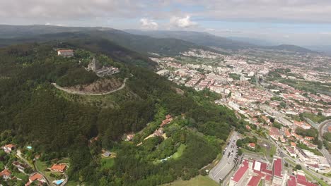 Viana-Do-Castelo-cityscape-with-Basilica-Santa-Luzia-on-hilltop,-aerial-drone-shot