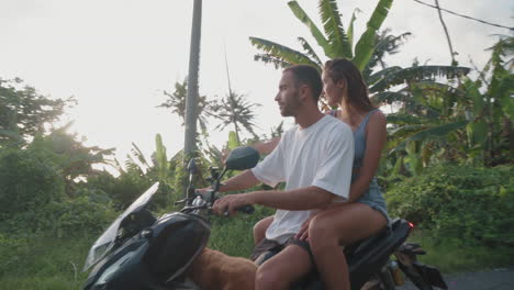 couple on scooter stopping for sightseeing