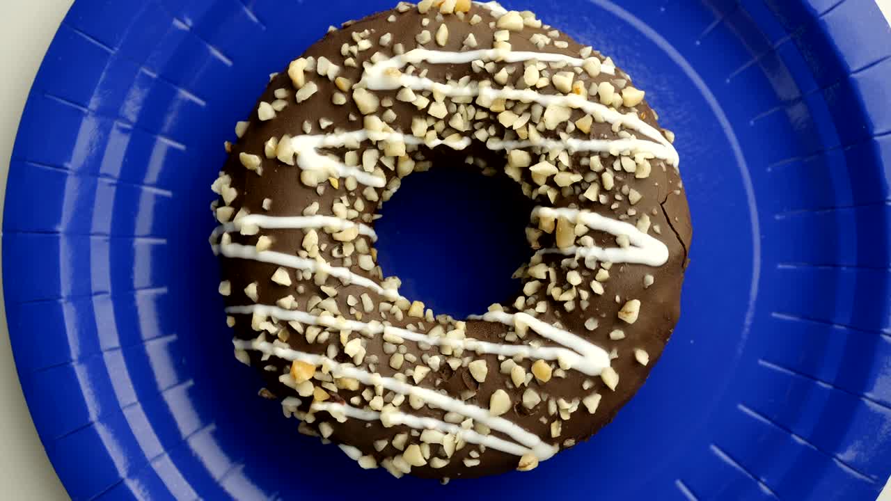 el donut está vidriado de cerca, con un bucle sin costuras.