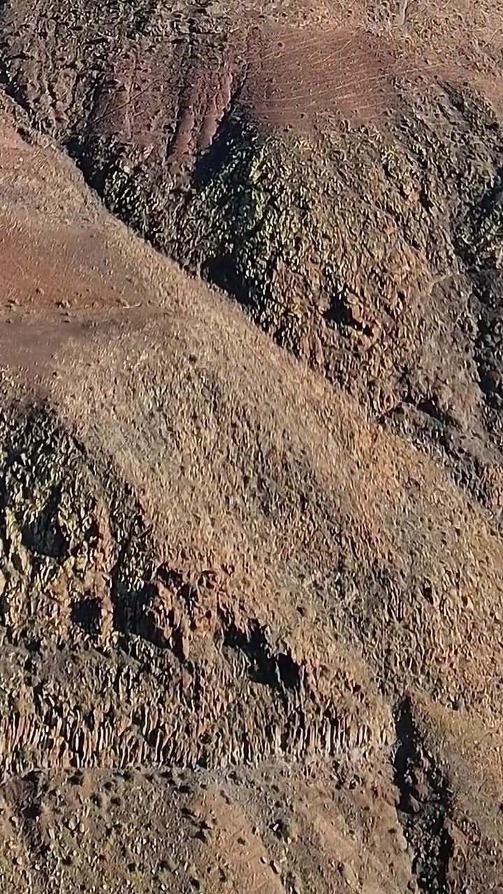Aerial view of dry terrain in Fuerteventura, Spain during daylight