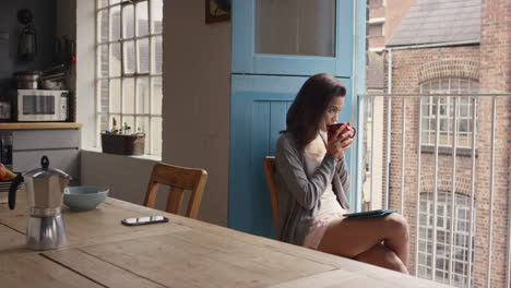 morning coffee for mixed race woman happy at home in pajamas