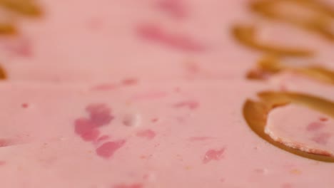 ham italian mordatella, man slices of traditional italian antipasti mortadella sausage on a wooden cutting board, close up macro of chicken or turkey jamon, fat breakfast dish.