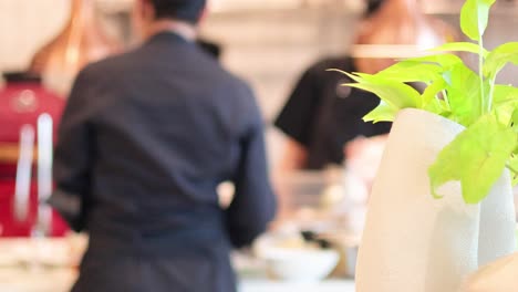 people working together in a bustling restaurant