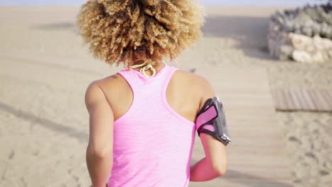 Healthy-fit-woman-jogging-away-from-the-camera