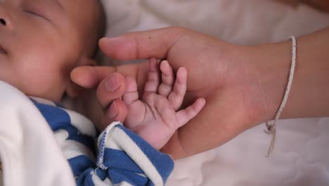 hands of mother and baby, video in 4k