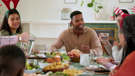 at christmas, diverse family enjoying festive meal together, sharing laughter and holiday cheer at h
