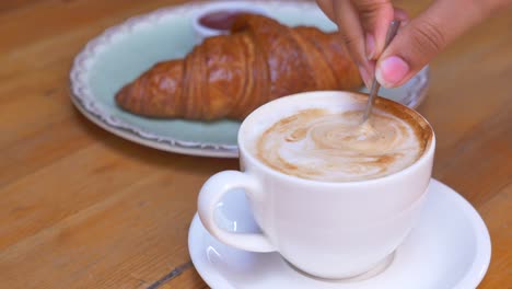 croissant and cappuccino breakfast