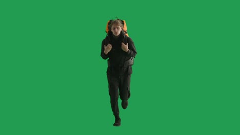 man running with backpack on green screen