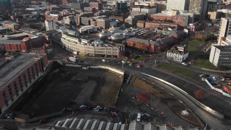 Drone-shot-above-the-city-of-Sheffield,-panning-over-the-Train-Station,-Sheffield-Hallam,-Park-Hill-and-more