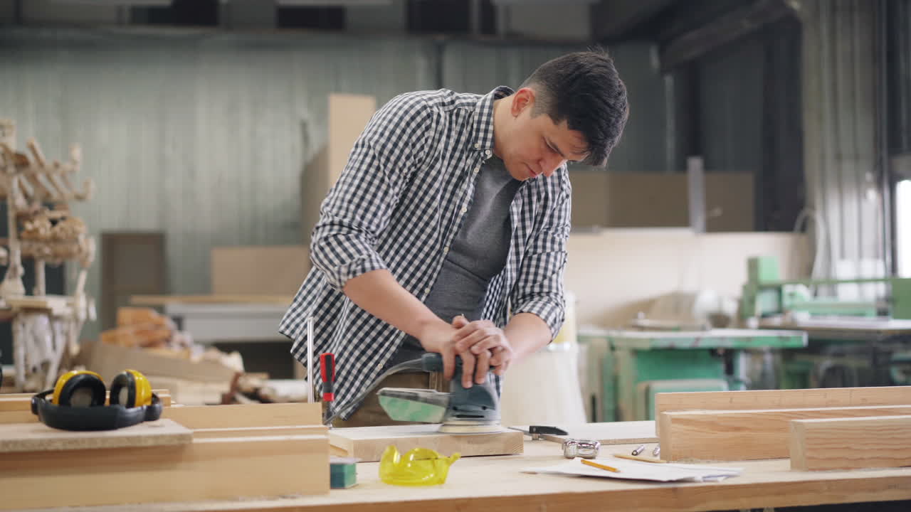 Carpenter sanding wood