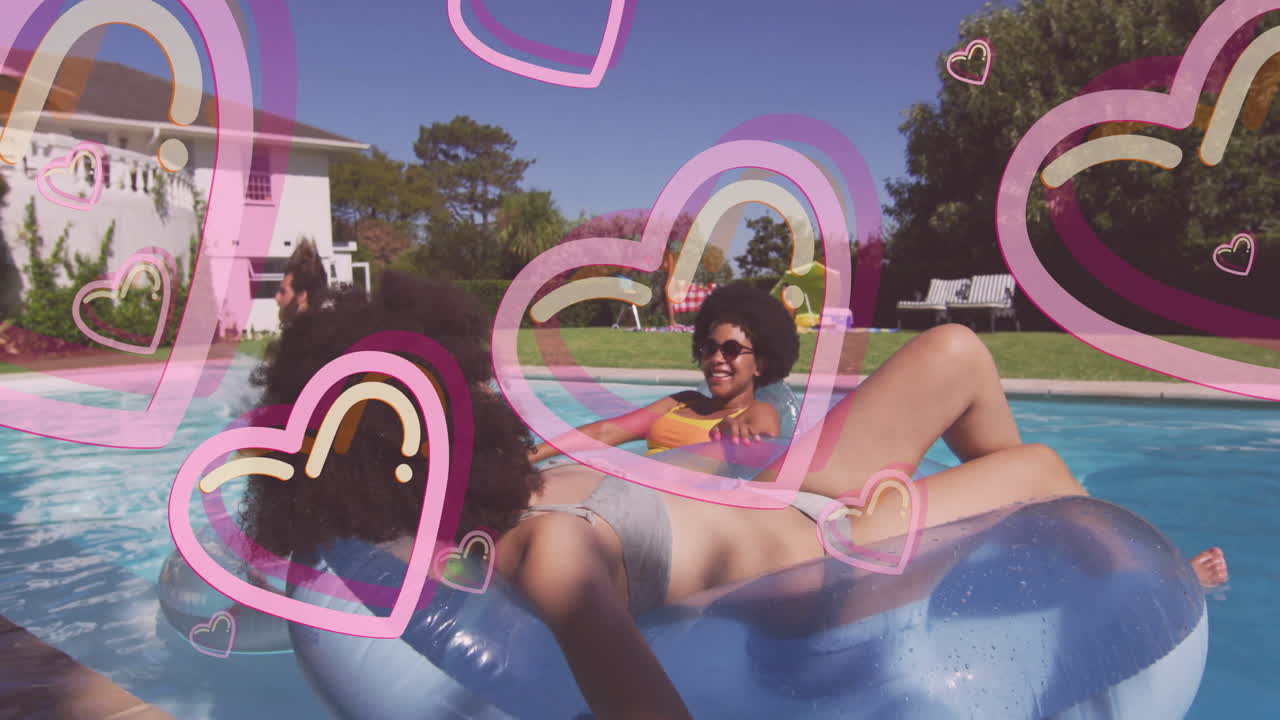People relaxing on pool floats with heart animations overlaying scene