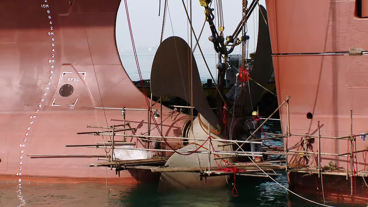 Oil tanker propeller repair in a dry dock; Al Shegaya