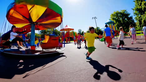 children playing at a colourful playground on a sunny day