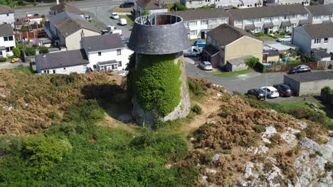 melin wynt y craig disused llangefni windmill ivy covered hillside landmark aerial view establishing welsh housing estate