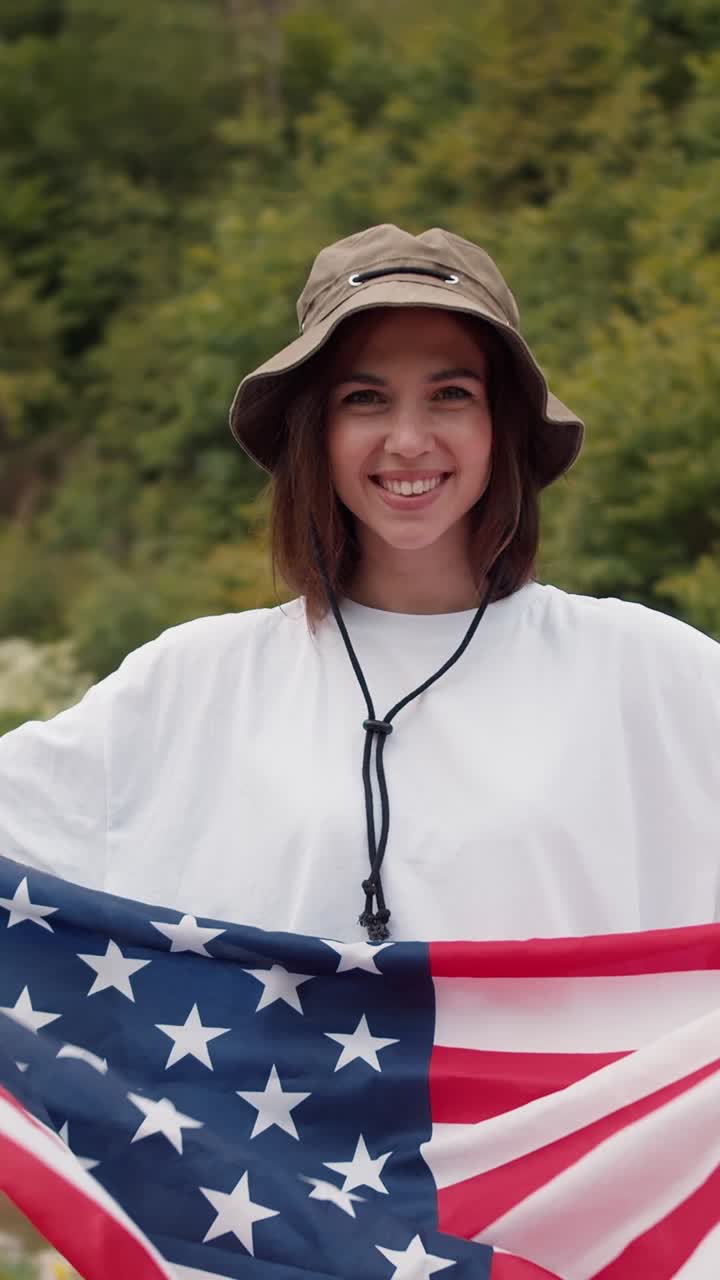 Woman Holding American Flag in Forest