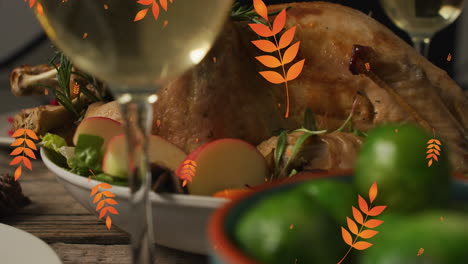 animation of autumn leaves falling over thanksgiving dinner background