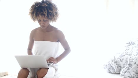 Young-Woman-Using-Laptop-Computer-In-Her-Room