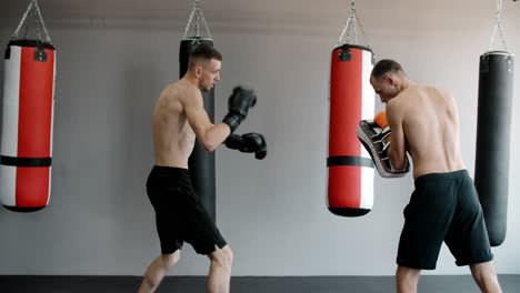 men practicing muay thai in a gym