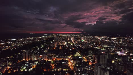 aerial of majestic vivid sunset lights over santo domingo city