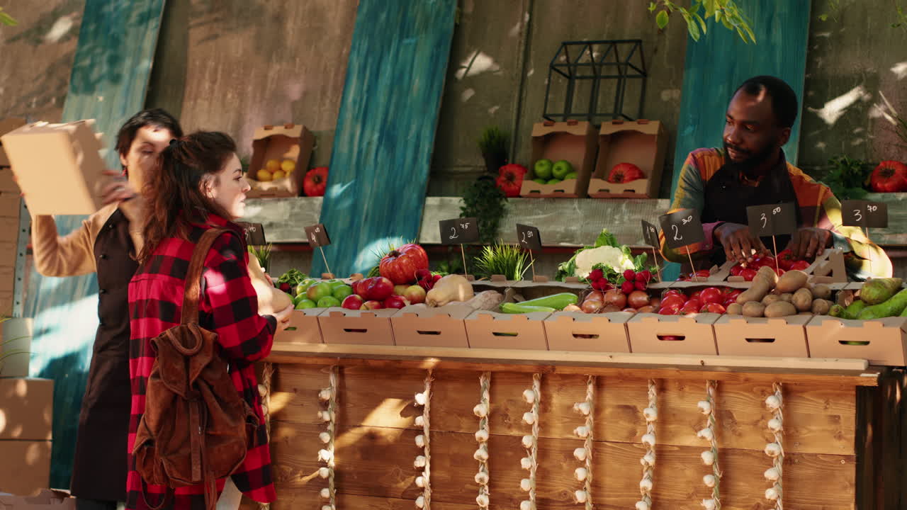 People buying produce at a farmer's market