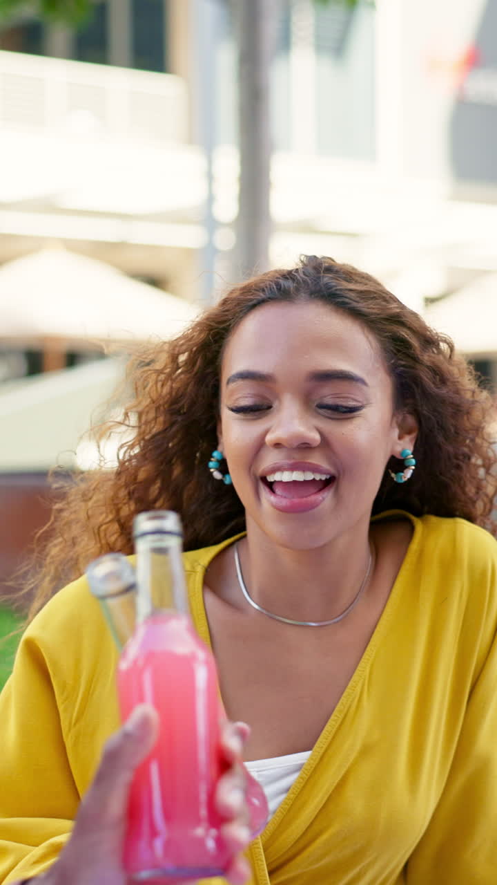 Woman enjoying a refreshing pink lemonade cocktail