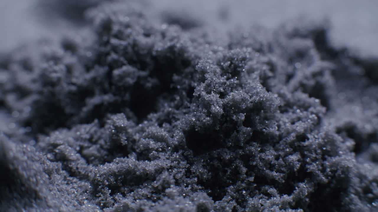 Close-up view of dark sand