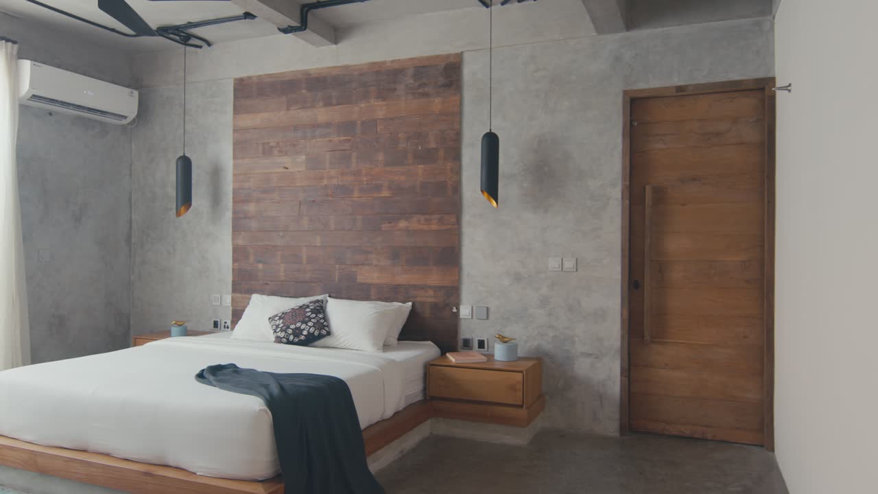 Beautiful interior of bedroom with double bed with gray walls in hotel room