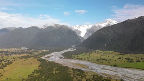 Aerial-scenic-of-Fox-Glacier-village,-famous-tourist-attraction-in-New-Zealand