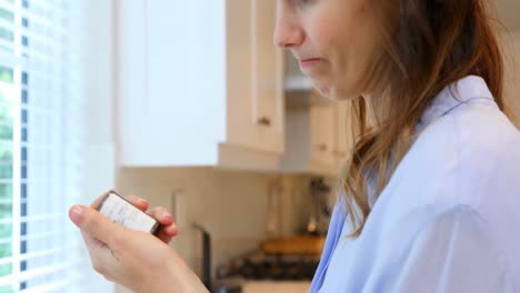 worried woman standing in kitchen 4k