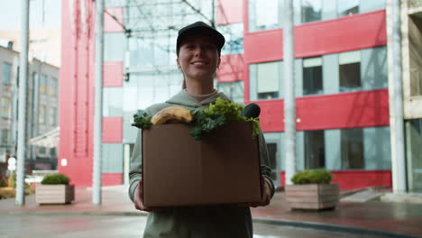 courier holding box outdoors