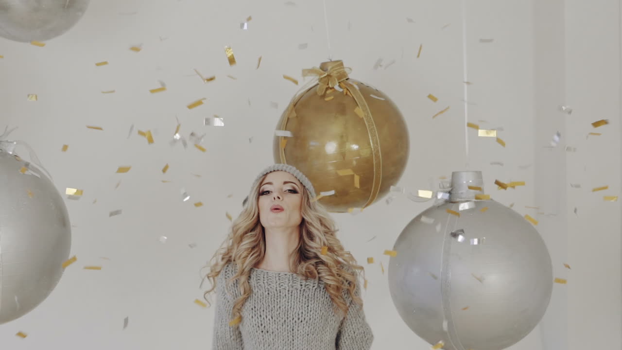 Celebration party of New Year. Young woman holding confetti happy and funny concept