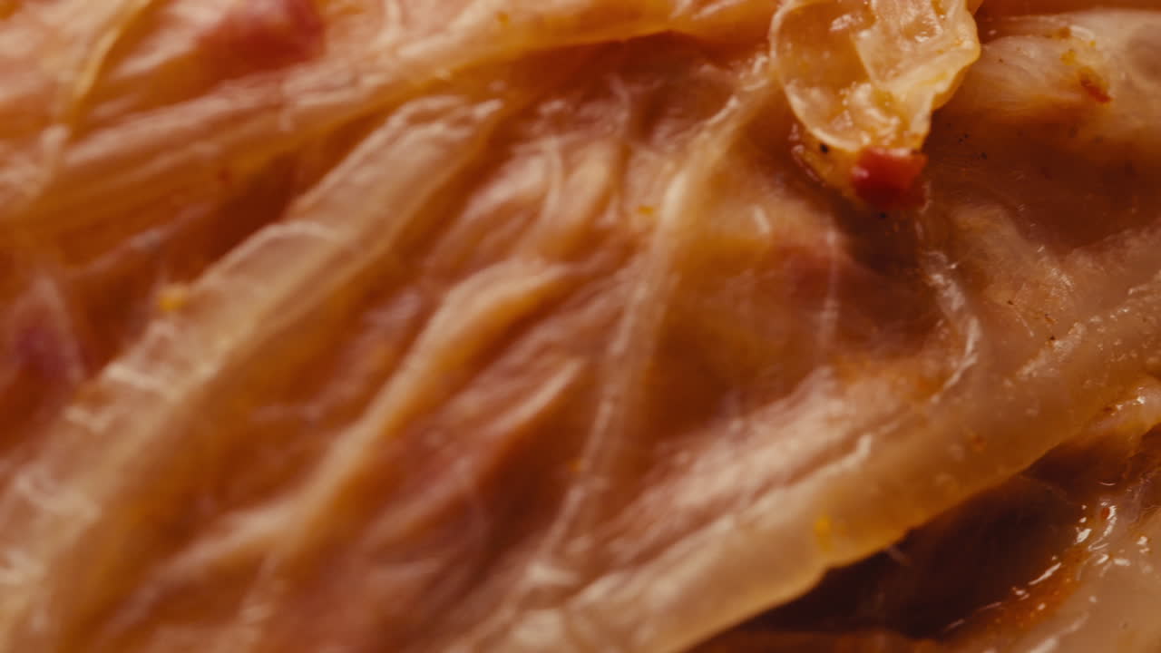 Close-up of texture fermented spicy cabbage kimchi with in can. Preservation of vegetables in glass jars. Fermentation preserved kimchi cabbage with spices macro. Asian cuisine.