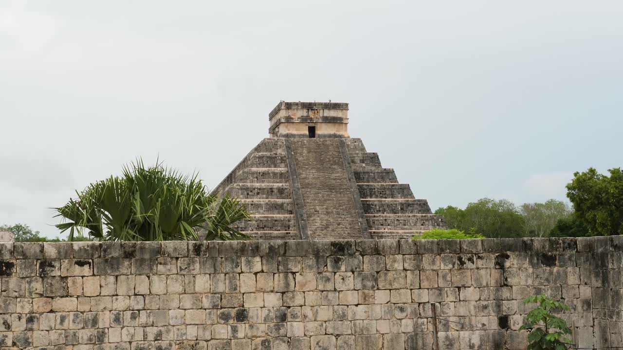 Famous Temple of Kukulcan (El Castillo) at Chichen Itza archaeological site in a cloudy day