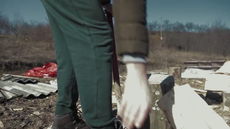cracking fire wood with a bad axe