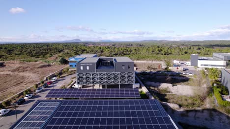 aerial shot overhead corporate offices with roofs covered with solar panels