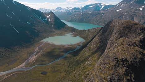 A-river-flows-through-the-valley-into-the-Ovre-Leirungen-and-can-be-seen-from-the-Knutshoe,-beautiful-scenery-in-Norway