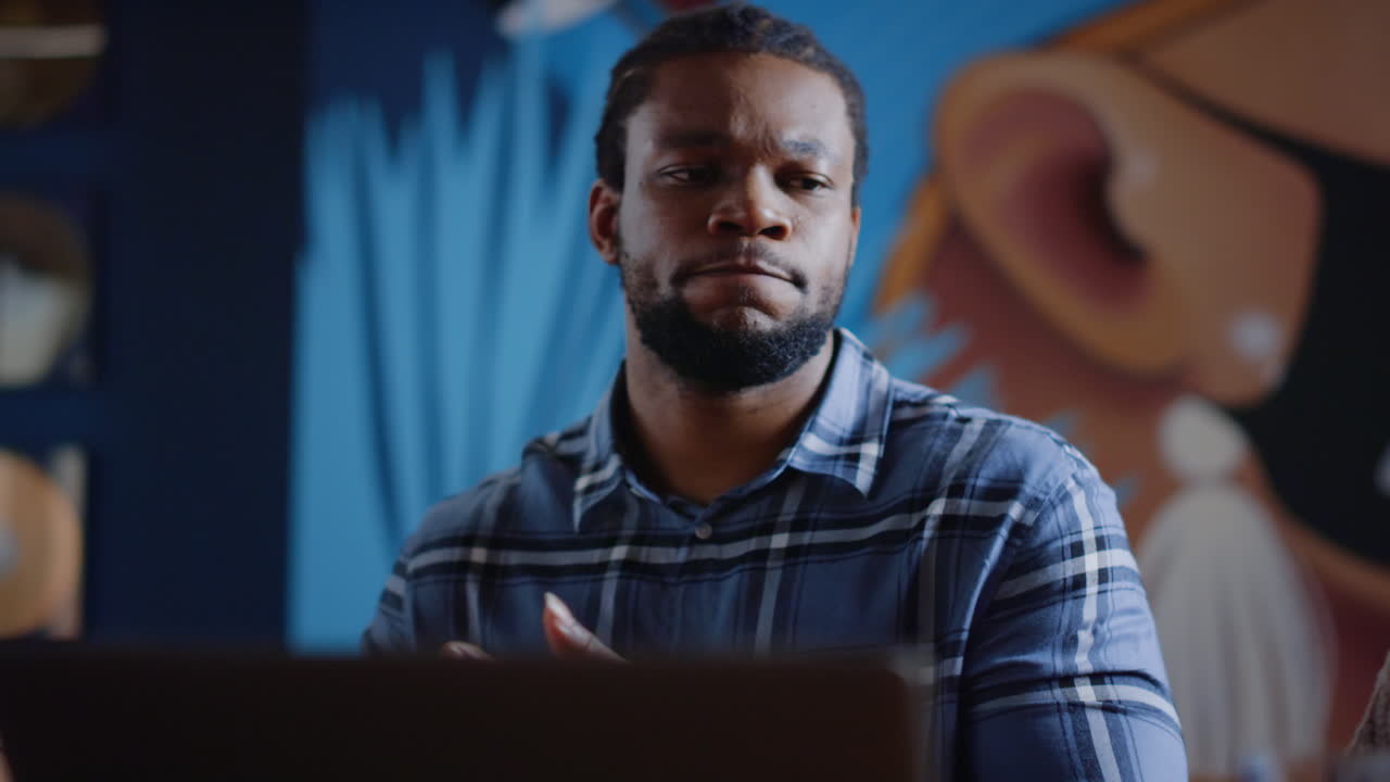 Man crumpling document in office
